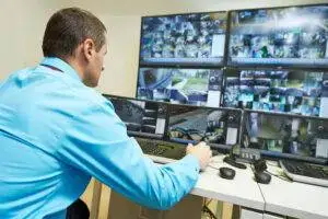 “Security monitoring room with officers reviewing surveillance footage to protect Marina Del Rey properties.”