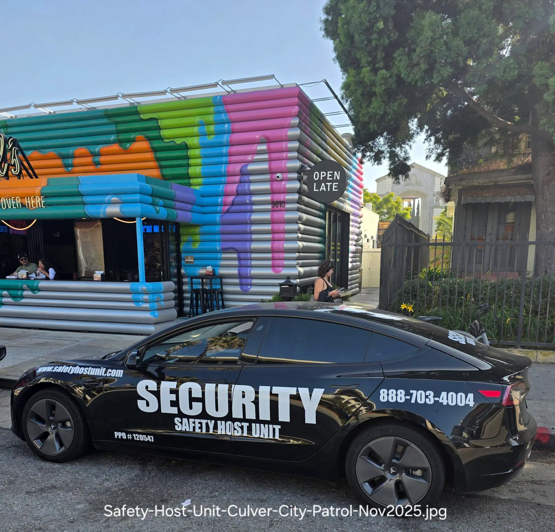 “Safety Host Unit patrol vehicle parked on a city street, displaying a professional security presence.”