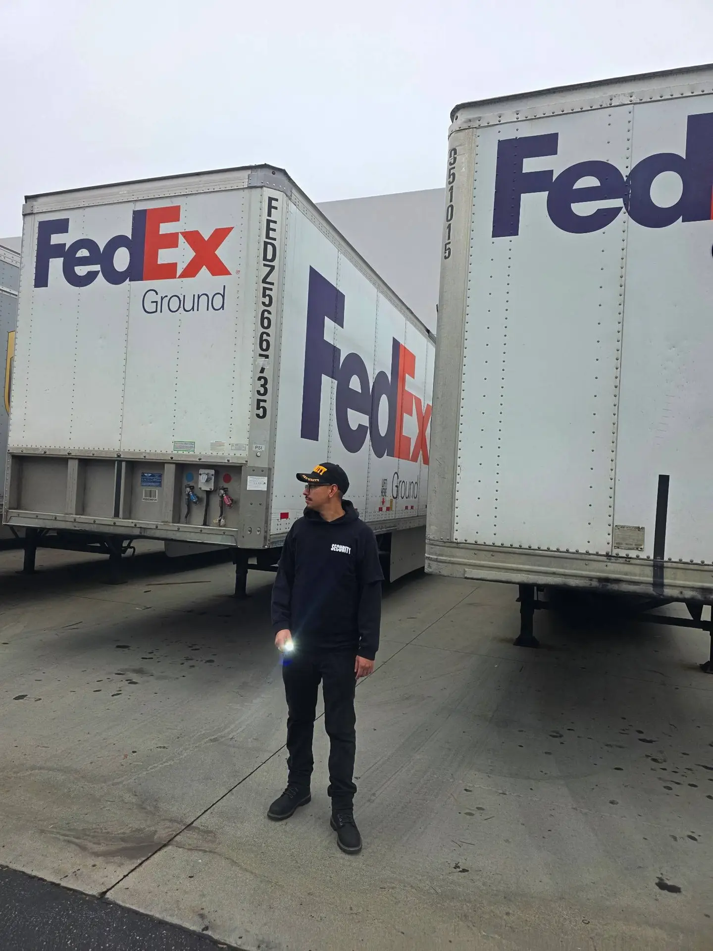 Security guard conducting warehouse patrol at FedEx facility in Los Angeles County