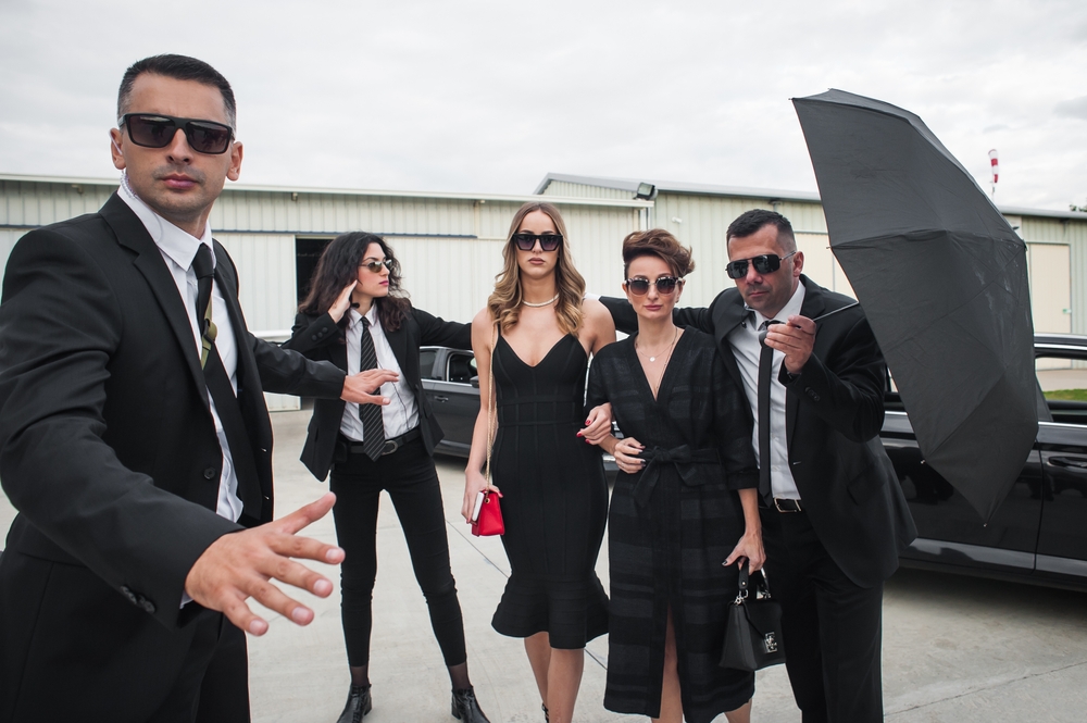 Professional,team,of,female,and,male,bodyguards,protect,famous,vip